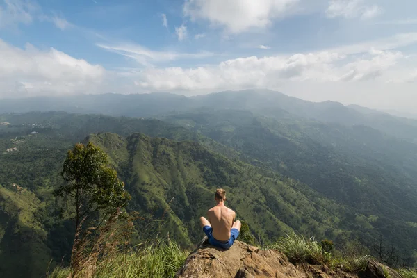 depositphotos_104841316-stock-photo-man-sitting-at-the-edge