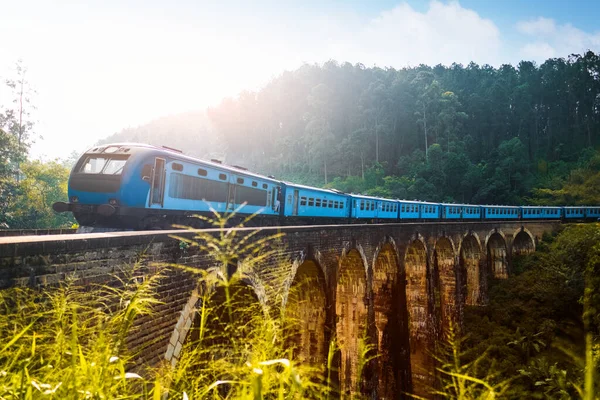 depositphotos_362762136-stock-photo-train-passing-viaduct-named-nine