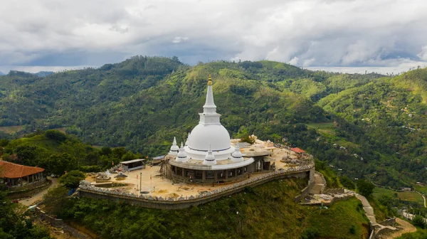 depositphotos_651057656-stock-photo-mahamevnawa-buddhist-monastery-temple-mountain